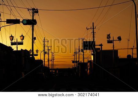 Silhouette Electric Pole And Cable Over The Dramatic Sunset, Japan.