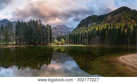 View Of Mount Skuta. Plansar Lake Or Plansarsko Jezero On Valley Zgornje Jezersko In Autumn. Norther