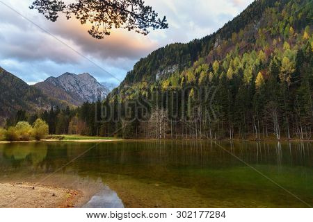 View Of Mount Skuta. Plansar Lake Or Plansarsko Jezero On Valley Zgornje Jezersko In Autumn. Norther