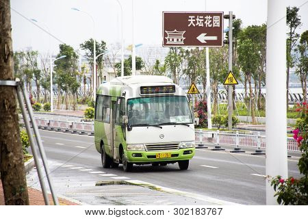 Chinese People Drive Bus And Passengers On Nanbin Street With Traffic Road At  Shantou Town Or Swato