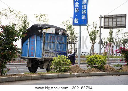 Chinese People Drive Truck On Nanbin Street With Traffic Road At  Shantou Town Or Swatow City On May