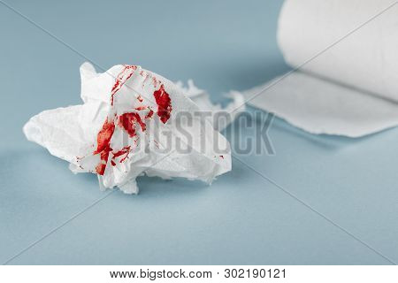 Blood On Tissue Paper On White Background. Health Medical Concept.