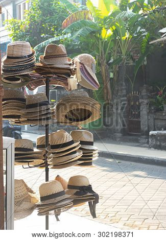 Various Straw Hat On Sale. Hat Street Seller In Bali.