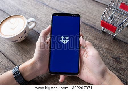 Chiang Mai, Thailand - May 11,2019: Man Hands Holding Oneplus 6 With Dropbox On The Screen. Dropbox 