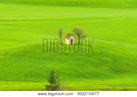 Small House In Countryside Landscape. Fields And Countryside Landscape.small House In Nature On Gree