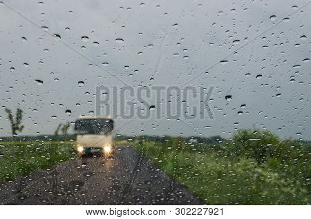 Drops Of Rain On The Glass - Car Traffic On The Road In Stormy Weather