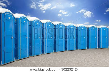 3d Illustration Of A Group Of Mobile Blue Bio Toilets.