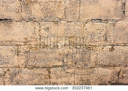 Brick Wall Fragment. Old Dirty Orange And Red Bricks With Defects. Grunge Texture With Cracks And We