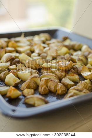 Roasted Potatoes Close Carlic Clovesin The Trey