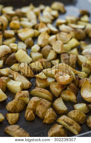 Roasted Potatoes Close Carlic Clovesin The Trey