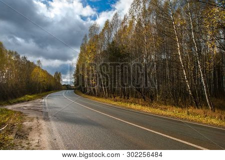 The Highway Through The Autumn Wood In Sunny Day, Mari El, Russia, 88k-002