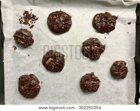 Raw Cookies On Oven Tray Ready To Cook / Chocolate Brownie With Walnut Cookie.