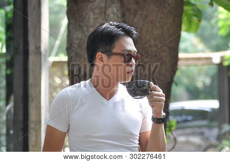 Unaware Man Or A Man Is Drinking Coffee