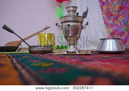Crystal Glass Of Tea On With Metal Samovar . Cast Iron Old Pot . Iron Wok Very Old . Azerbaijan Tea 