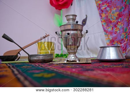 Crystal Glass Of Tea On With Metal Samovar . Cast Iron Old Pot . Iron Wok Very Old . Azerbaijan Tea 