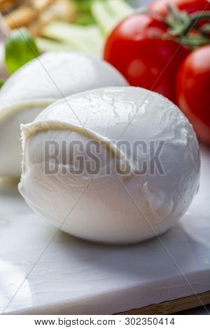 Balls Of Buffalo Mozzarella, Soft Italian Scheese Made From The Milk Of Italian Mediterranean Buffal