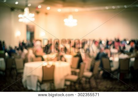 Blurry Background Diverse People At Gala Dinner In Hotel Banquet Room