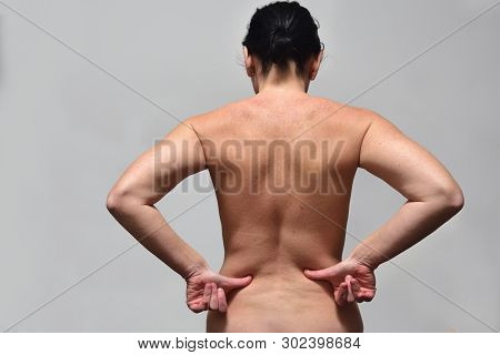 Middle Aget Woman With Low Back Pain