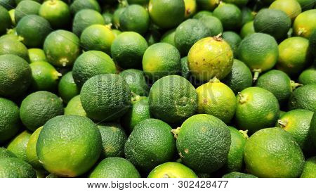 Close Up Of Calamansi Green Limes In Market