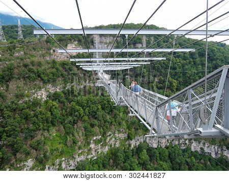 Sochi, Russia - June 10, 2016: Elderly Women Are Not Afraid To Take Extreme And Walk Under The Suspe
