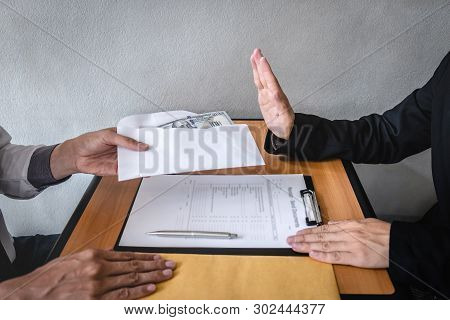 Anti Bribery And Corruption Concept, Business Man Refusing And Don't Receive Money Banknote In Envel
