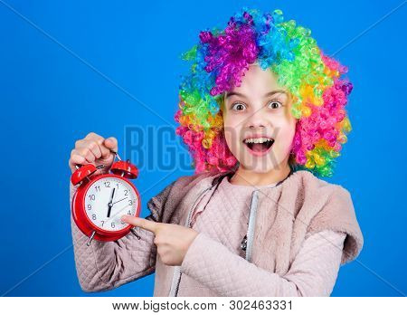 Focusing On Accuracy. Happy Small Child Pointing At Alarm Clock. Little Girl Smiling With Clock. Acc