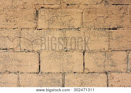 Brick Wall Fragment. Old Dirty Orange And Red Bricks With Defects. Grunge Texture With Cracks And We