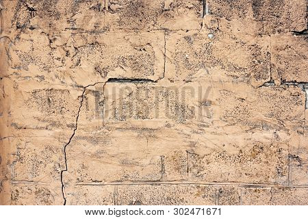 Brick Wall Fragment. Old Dirty Orange And Red Bricks With Defects. Grunge Texture With Cracks And We