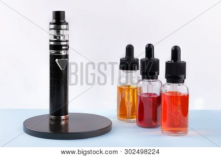 Electronic Cigarette And Glass Bottles With Vape Liquid On White Background