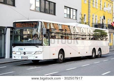 Salzburg, Austria - July 28, 2014: White Suburban Bus Mercedes-benz O550 Integro L In The City Stree