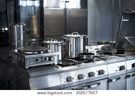 Work Surface And Kitchen Equipment In Professional Kitchen, View Counter In Stainless Steel.