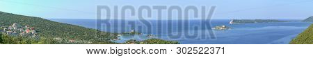 Bay Gertsegnovska In Adriatic Sea And Entrance To Bay Of Kotor. Calm Sea And Clear Blue Sky. Island 