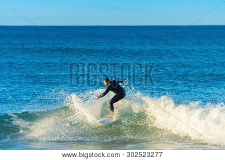 Peniche, Portugal - December 04, 2016: Surfer Ride A Wave On Surfboard In Peniche. Peniche - Famous 