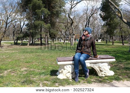 Woman Sitting On Bench In Spring, Malakhov Kurgan, Sevastopol