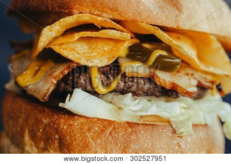 Burger Flyer. Cheese Burger With Grilled Meat, Cheese, Salad And Onion Rings. Close-up Of Delicious 