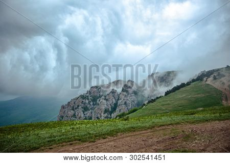 Storm Clouds In The Mountains On A Summer Morning.
