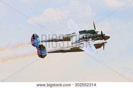Pilsen / Czech Republic - September 9, 2018: Flying Bulls Red Bull sponsored Lockheed P-38 Lightning. Rare fighter plane over Pilsen.
