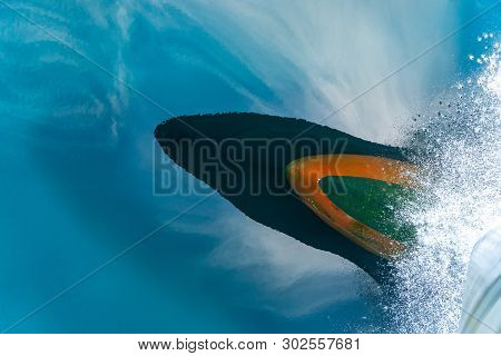 Bulbous Bow Of The Warship Sailing Through The Sea Created Wave Piercing Water Splash With Reflectio