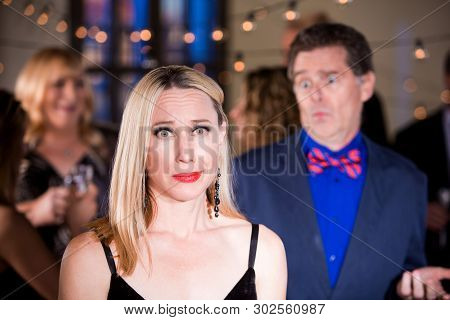 Disappointed Woman And Confused Man At Party
