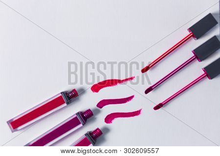 Smudged Three Red Lipstick Isolated On White