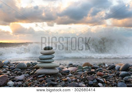 Stone Pyramid Of Pebble Against The Background Of The Blue Sea On Pebl-bich, For Spa, Meditation