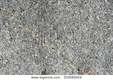 Close Up Macro View Of Rough Grey Stone Surface. Detailed Nature Background Or Pattern Texture Taken