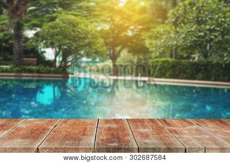 Wood Walk Outdoor In Ground Residential Swimming Pool.