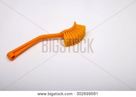 Massage Brush On A White Background. Orange Massage Brush. Cosmetics And Accessories For Bathrooms. 
