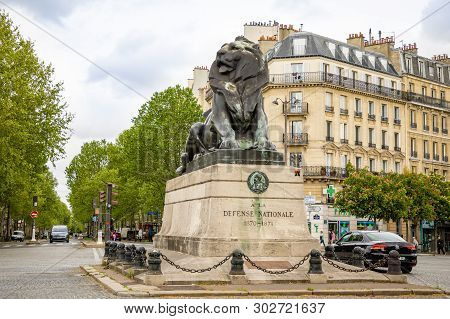 Paris, France - 24.04.2019: Lion Of F Belfort Statue In Denfert Rochereau Square In Paris In France