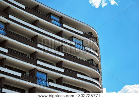 Modern Apartment Buildings On A Sunny Day With A Blue Sky. Facade Of A Modern Apartment Building