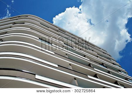 Modern Apartment Buildings On A Sunny Day With A Blue Sky. Facade Of A Modern Apartment Building