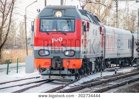 Russian Train. Locomotive With Cars. Passenger Train. . Russia Metallostroy March 8, 2019