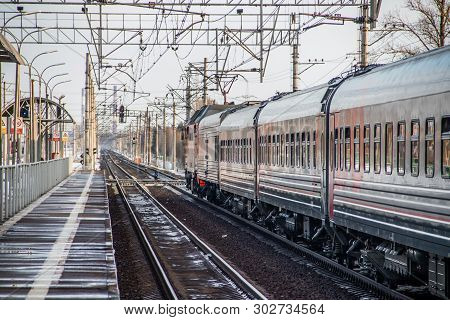 Russian Train. Locomotive With Cars. Passenger Train. . Russia Metallostroy March 8, 2019