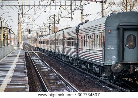 Russian Train. Locomotive With Cars. Passenger Train. . Russia Metallostroy March 8, 2019